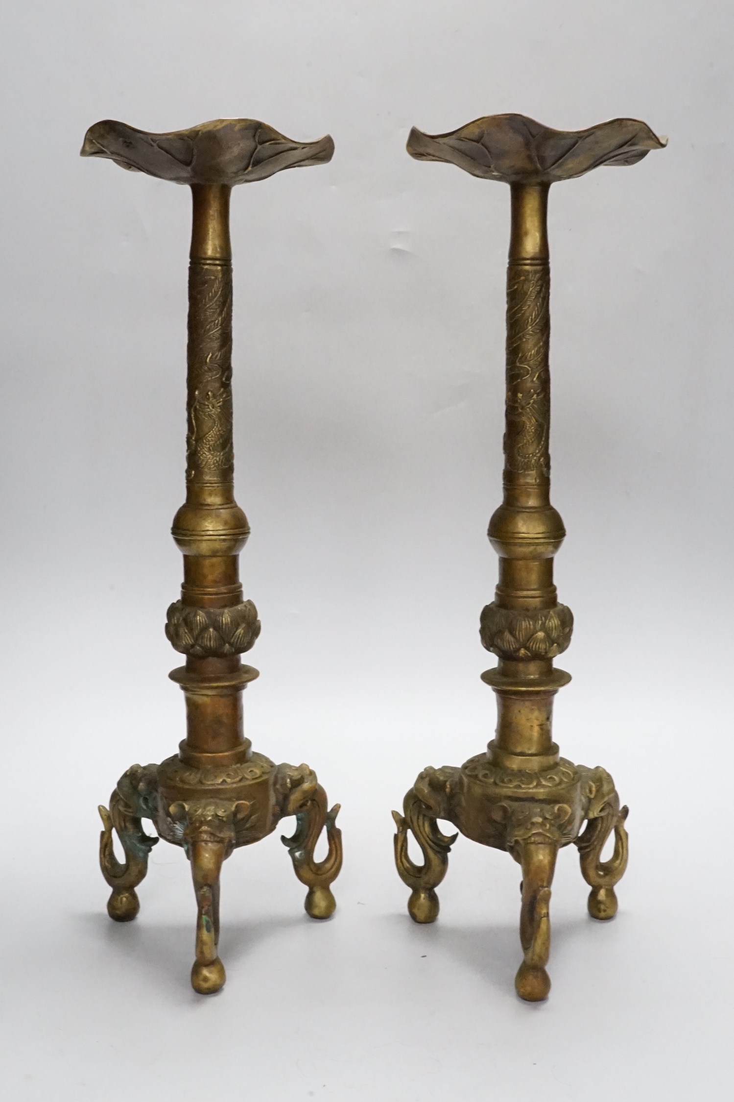 A pair of Chinese bronze altar sticks, 41.5cm high